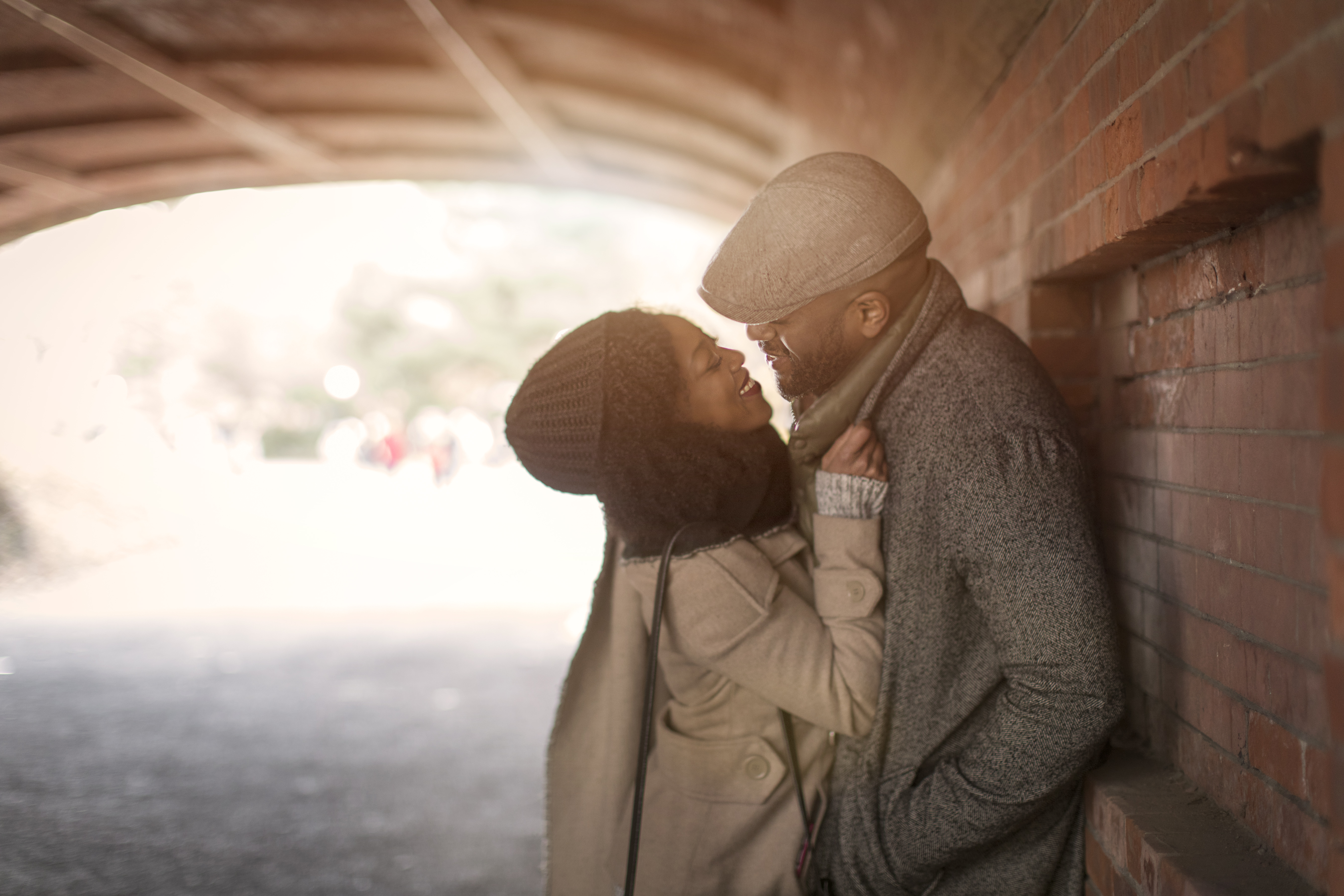 Romantic couple face to face in tunnel