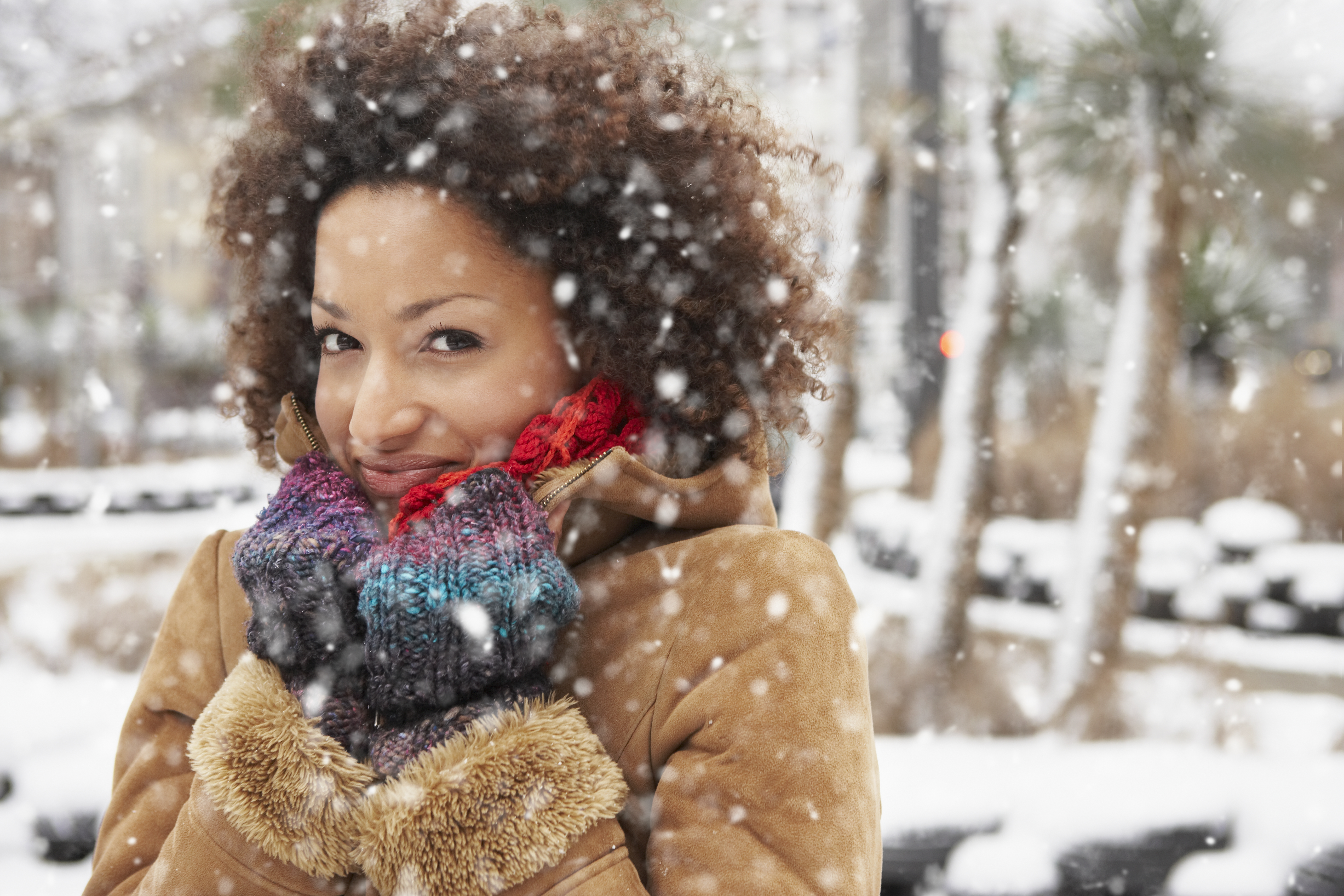 Young woman enjoying snowfall