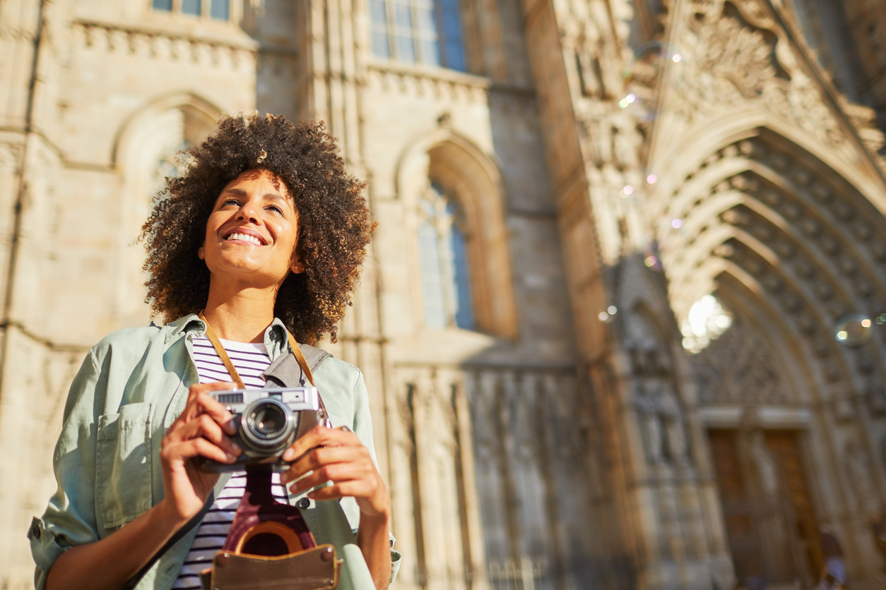Young hipster woman touring in the streets of Barcelona