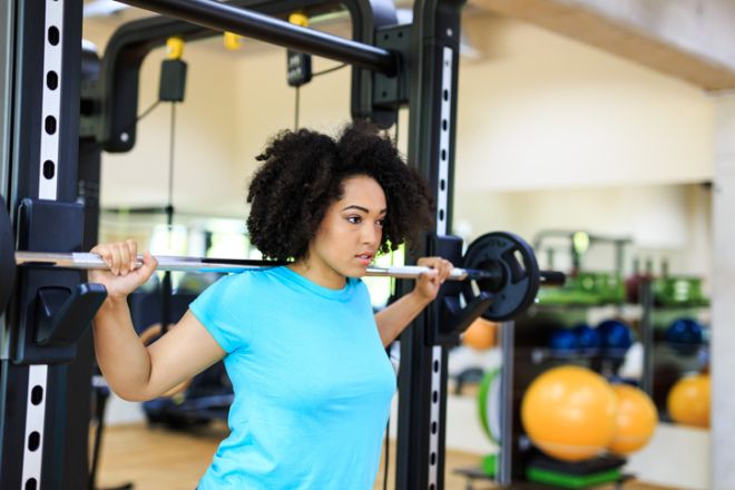 African woman practicing in gym