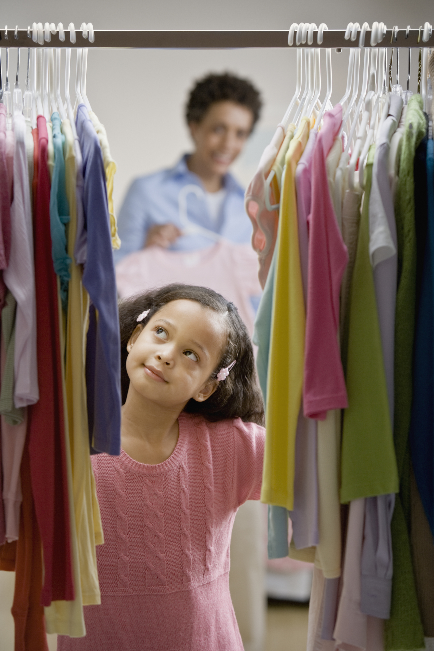 Mixed Race girl clothing shopping