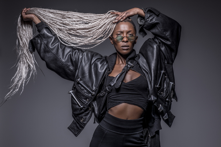 Beautiful Black dreadlocked Woman in Studio Setting