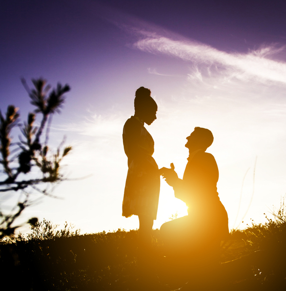 Diverse Couple Engagement Silhouettes at Sunset