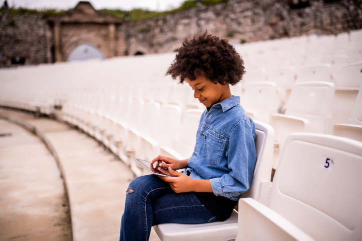 Young girl using digital tablet.