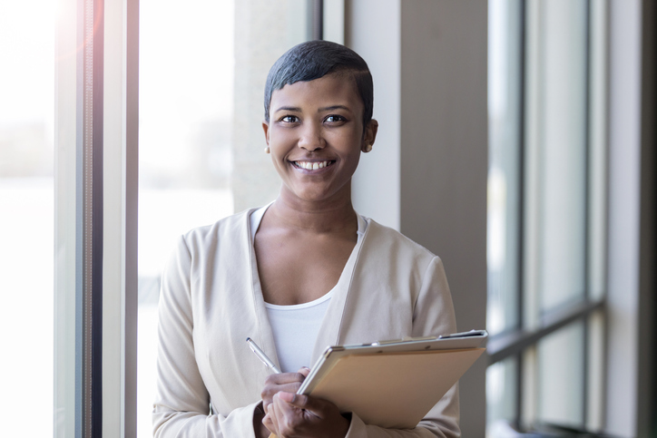Confident businesswomen smiles at the camera