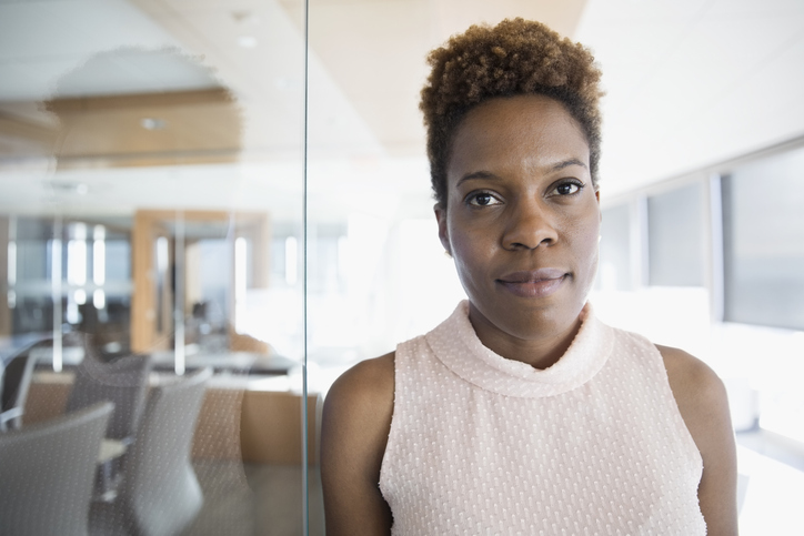 Portrait serious, confident businesswoman