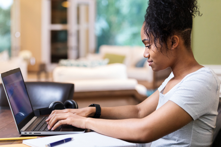 Young woman studies for college exam