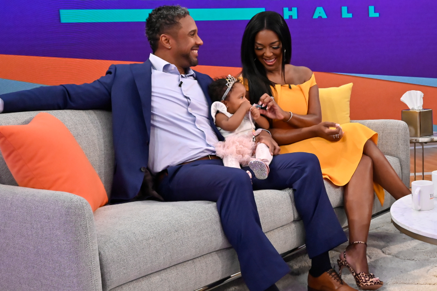 Kenya Moore men holding daughter