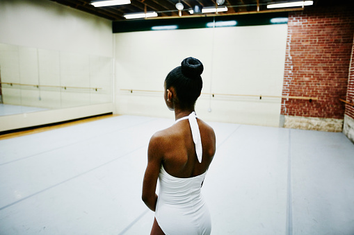 Female ballet dancer resting during rehearsal