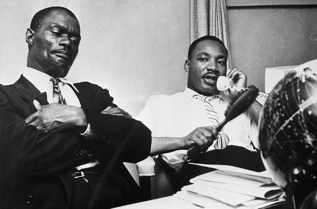 M.L. King Seated Talking On Telephone