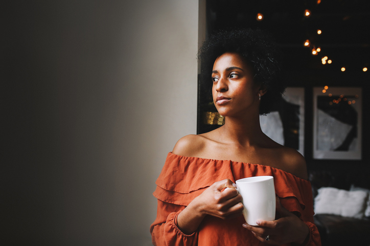 Portrait of a young woman having coffee in her Downtown Los Angeles apartment