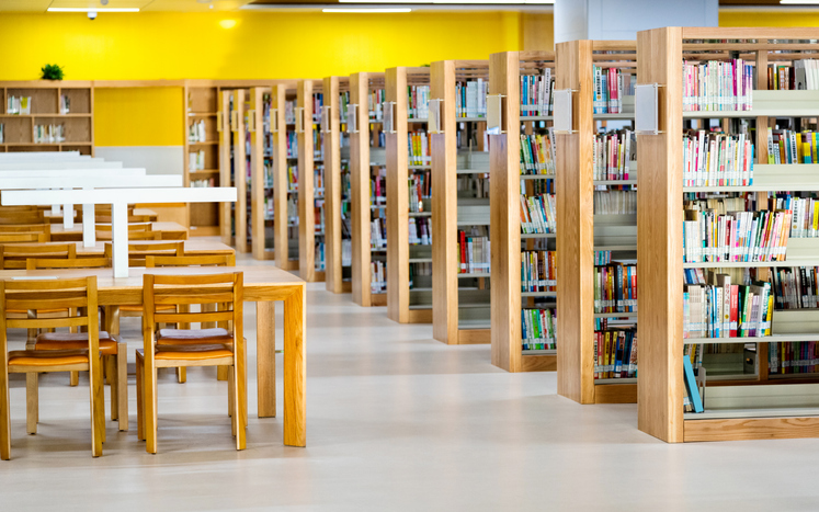 Empty wooden tables in public library