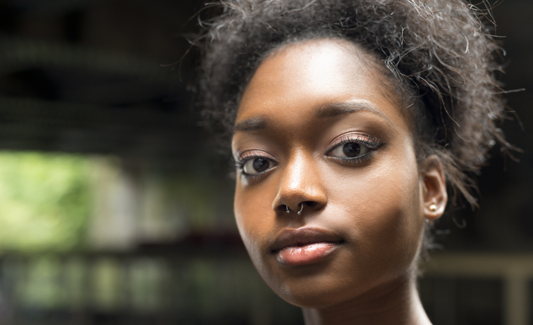 Close up Street's portraits of a strong young woman looking in the camera in in Camden Lock, London, U.K.