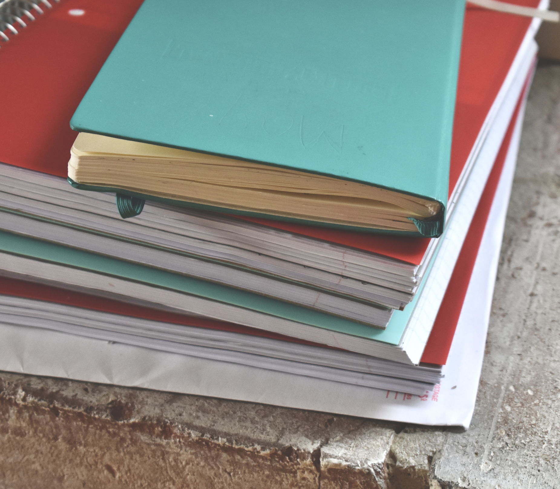 Red and turquoise spiral notebooks