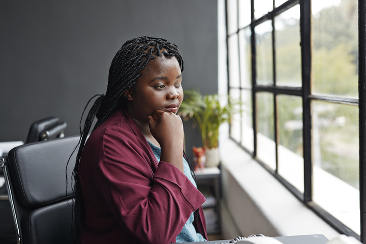 Businesswoman contemplating at modern workplace