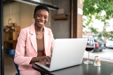 Portrait of a businesswoman working and using a laptop in a restaurant