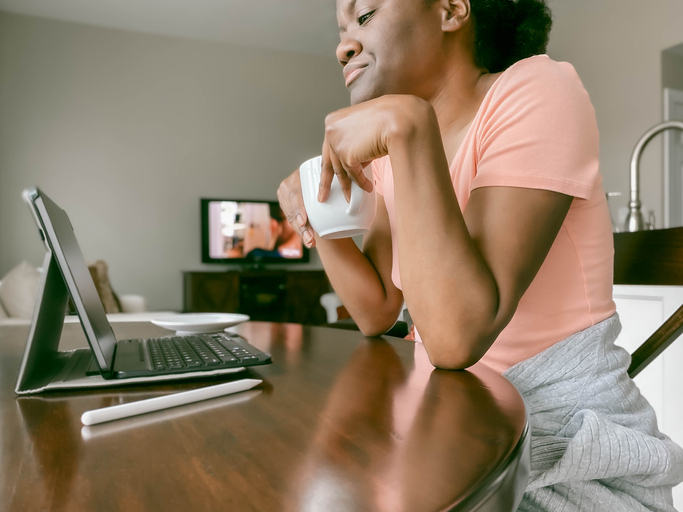 Woman Works at Kitchen Table