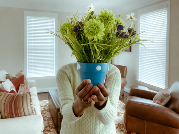 Woman Stands With Flower Pot