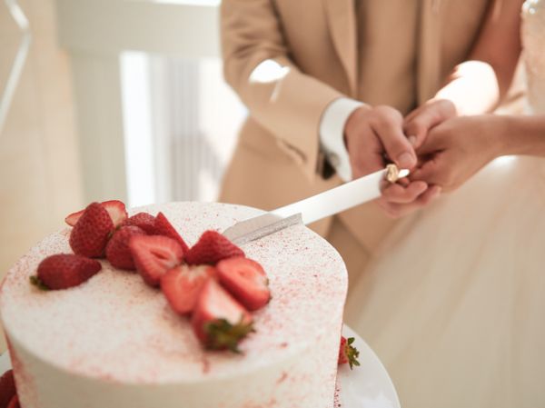 Wedding cake cut for the bride and groom.
