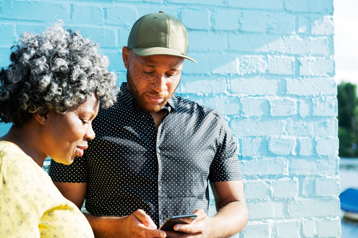 Man and woman looking at smart phone
