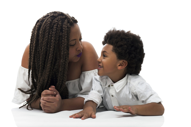 Mom and son talking while lying down on floor