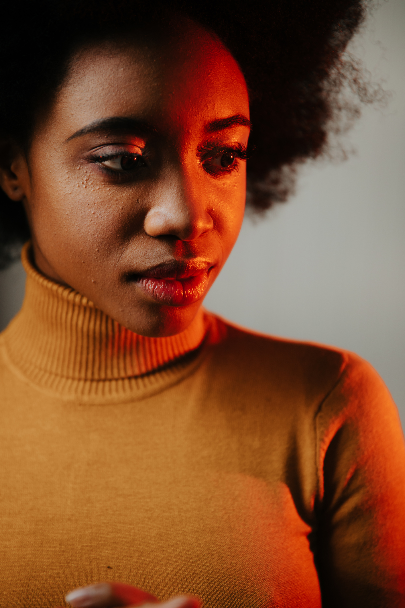 Portrait of sad beautiful mixed race woman in black. Sadness concept