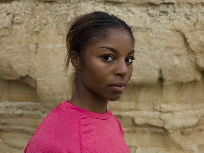 An apprehensive young woman looking sideways