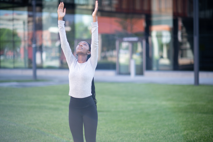 Doing yoga in the park