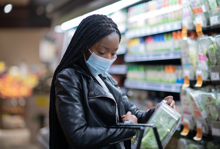 Young woman shopping in produce section