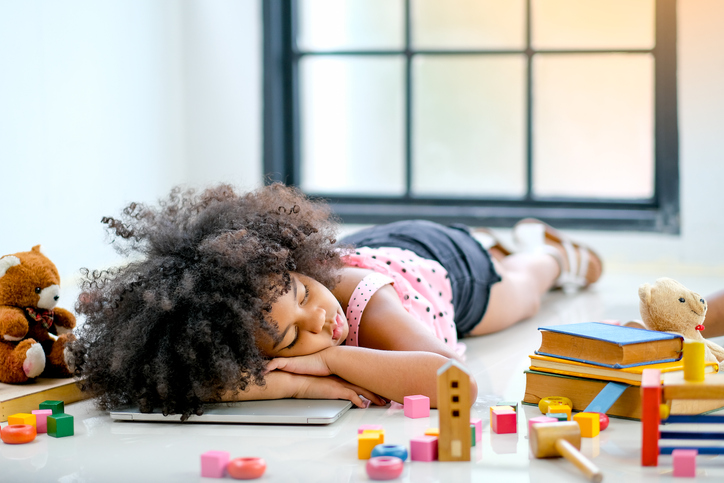 Girl Sleeping On Floor At Home