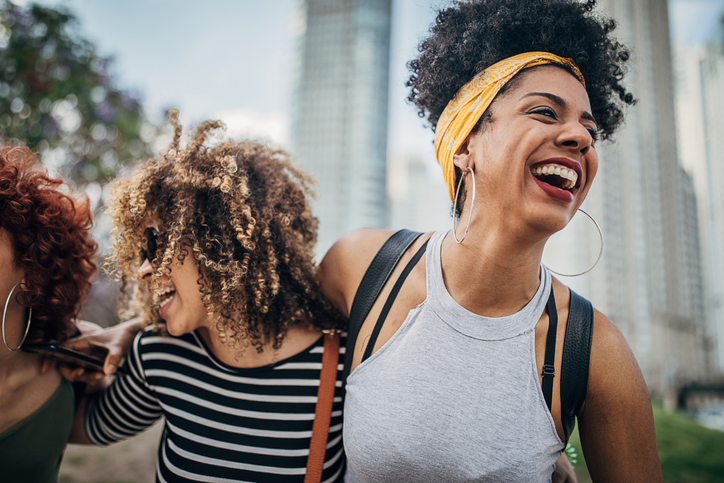 Happy women walking down the street