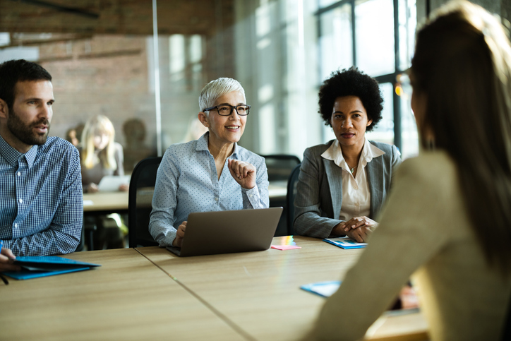 Human resource team talking to their candidate on a job interview.