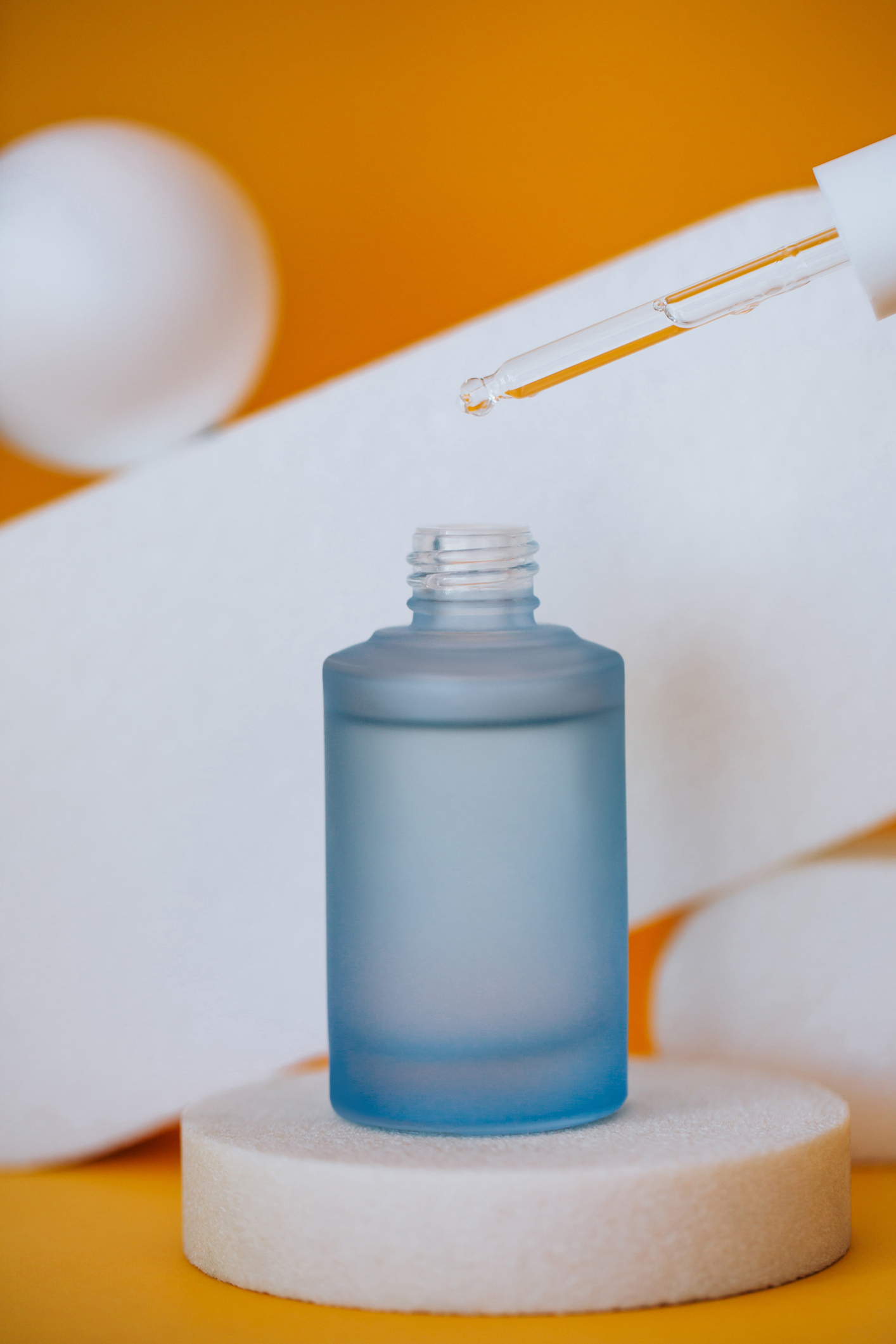 Glass bottle and pipette in studio