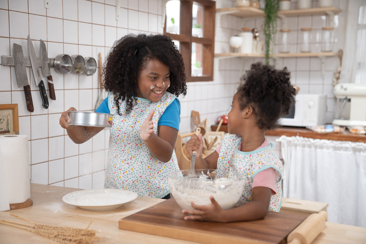 happy family funny kids are preparing the dough, bake cookies in the kitchen