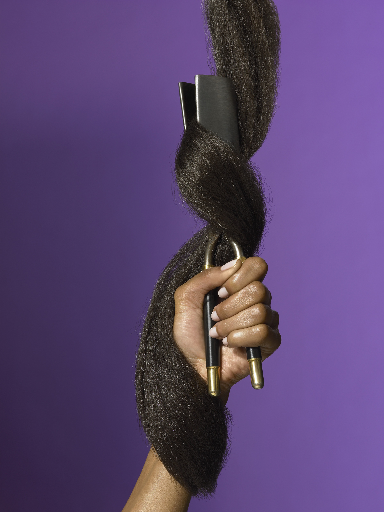 Woman with Hair Wrapped Around Flat Iron