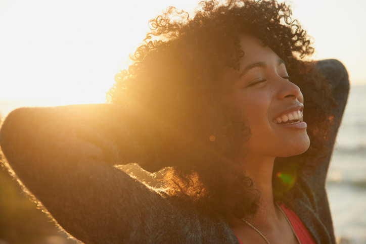 Black Woman with the sun behind her