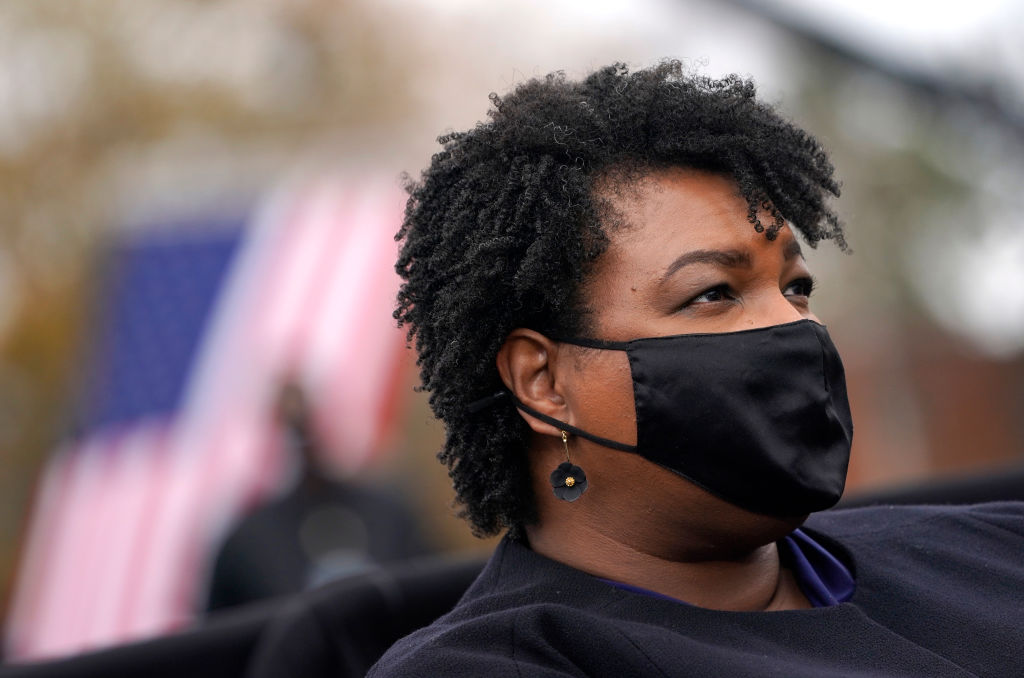 Stacey Abrams wearing mask at political rally was disparaged by a football coach who ended up losing his job over his comments