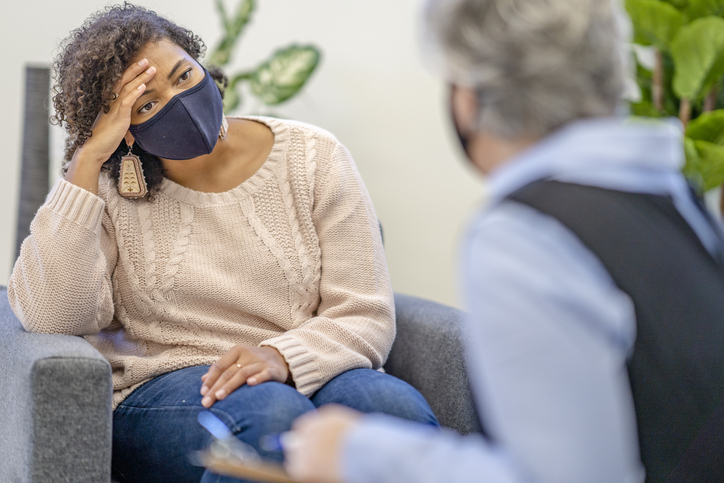 African female feeling down at therapy
