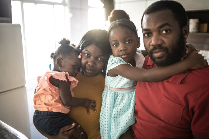Portrait of a family together at home