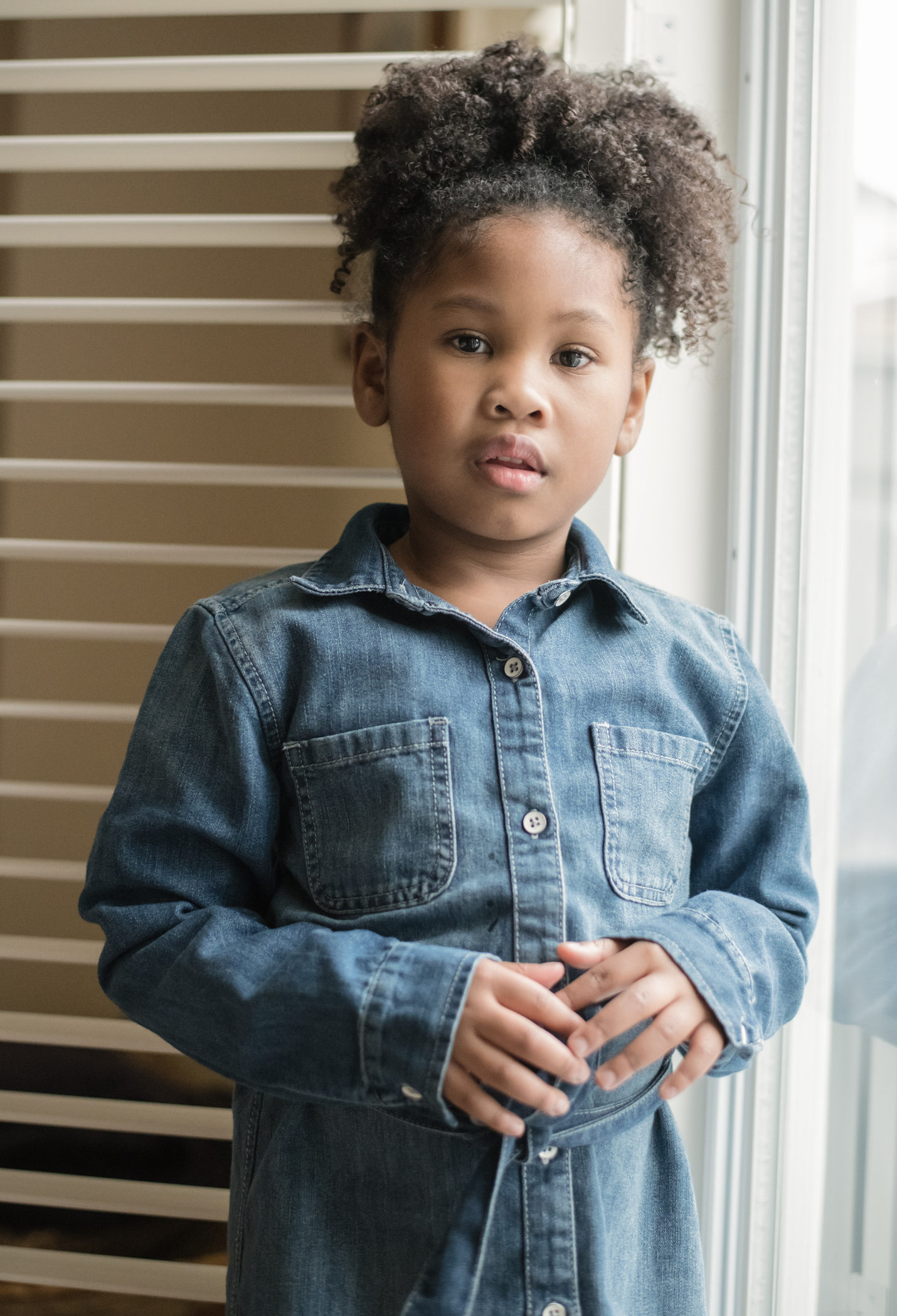 Portrait of a Serious Little Girl of African Descent