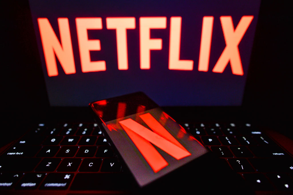 In this photo illustration the Netflix logo seen displayed...