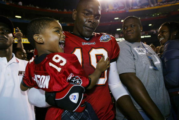 Johnson holds his son