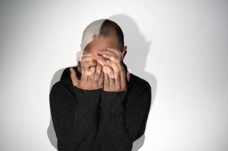 Man hiding face with his hands