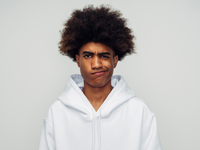Emotional african american man with african hairstyle