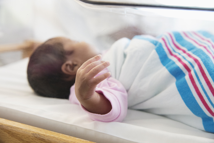 Newborn baby sleeping in crib