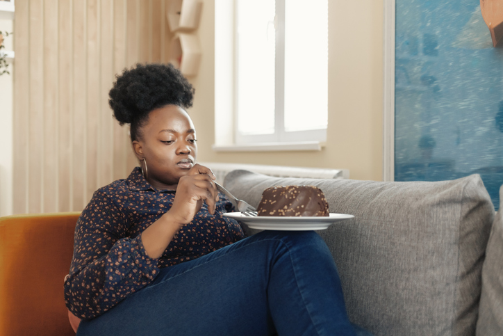 Overweight Woman Eating Sweet Cake