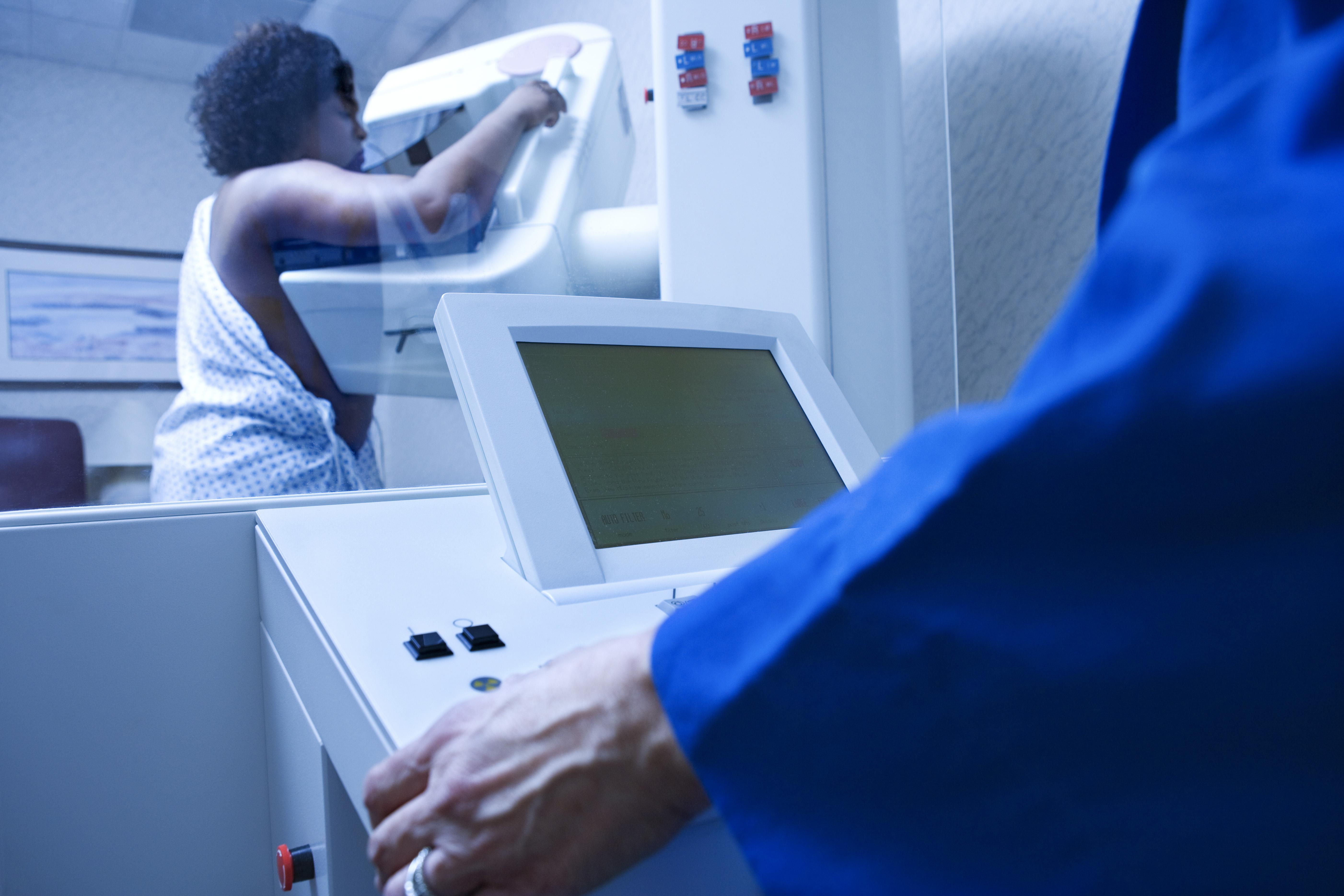 Woman getting mammogram
