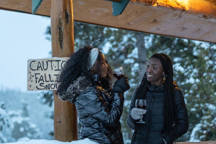 Women drink wine and chat on girls trip