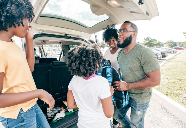 Dad driving children to school