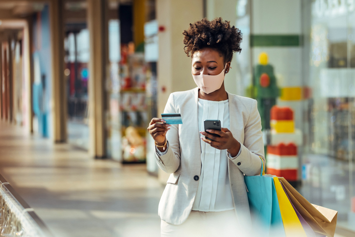 African woman is purchasing online